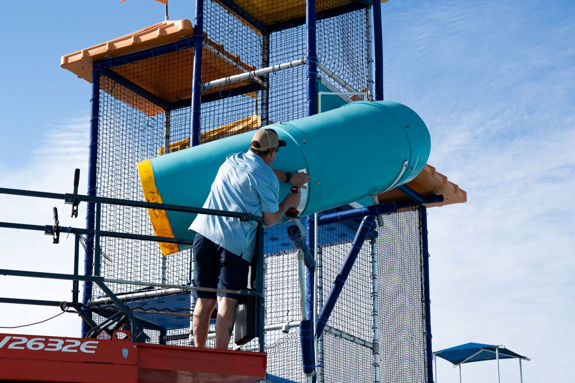 Employee repairing slide.