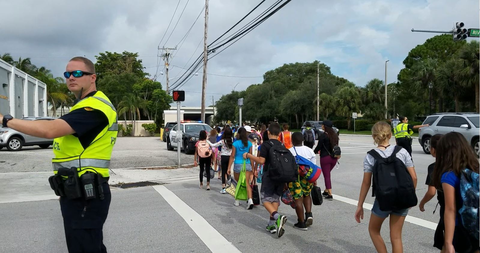 Officers Helping Children Crossing the Street